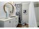 Bathroom with modern vanity and sink, and an enclosed tub shower with classic design at 565 E Rosebud Dr, San Tan Valley, AZ 85143