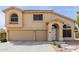 Charming two-story home with a three-car garage and well-manicured landscaping at 565 E Rosebud Dr, San Tan Valley, AZ 85143