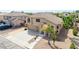 Inviting two-story home featuring a three-car garage, neutral stucco and tile roof at 565 E Rosebud Dr, San Tan Valley, AZ 85143