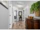 Charming hallway featuring tile floors, decorative table and ample doorways to other rooms at 565 E Rosebud Dr, San Tan Valley, AZ 85143