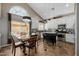 Eat-in kitchen featuring a chandelier, modern appliances, and island at 565 E Rosebud Dr, San Tan Valley, AZ 85143