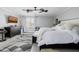 Modern bedroom featuring a ceiling fan, dresser and patterned rug at 565 E Rosebud Dr, San Tan Valley, AZ 85143