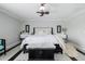 Calm bedroom with minimalist decor, ceiling fan, and neutral color scheme at 565 E Rosebud Dr, San Tan Valley, AZ 85143