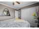 Bedroom with large closet with ensuite bath access, with neutral wall paint and dark trim accents at 565 E Rosebud Dr, San Tan Valley, AZ 85143