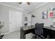 Office showing a large desk, built-in shelving, a comfortable workspace, and access to bath and closet at 565 E Rosebud Dr, San Tan Valley, AZ 85143
