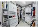 Spacious walk-in closet with custom shelving, drawers, and ample storage space for shoes and clothing at 565 E Rosebud Dr, San Tan Valley, AZ 85143