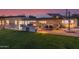 Expansive backyard featuring a built-in grill, patio, and lush lawn perfect for entertaining at 5960 E Orange Blossom Ln, Phoenix, AZ 85018