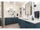 Sleek bathroom featuring double sinks, stylish fixtures, and modern design at 5960 E Orange Blossom Ln, Phoenix, AZ 85018
