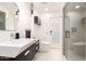 Contemporary bathroom featuring modern sink, sleek toilet, and glass shower enclosure at 5960 E Orange Blossom Ln, Phoenix, AZ 85018