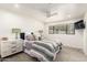 Cozy bedroom with a ceiling fan, comfortable bed, and natural light at 5960 E Orange Blossom Ln, Phoenix, AZ 85018