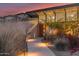 Contemporary home featuring a walkway to a bright orange front door, xeriscaping, and clerestory windows at 5960 E Orange Blossom Ln, Phoenix, AZ 85018