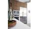 Modern kitchen with stainless steel appliances, white countertops, and plenty of counter space at 5960 E Orange Blossom Ln, Phoenix, AZ 85018