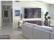 Cozy living space featuring a comfortable sofa, stylish decor, and seamless transition to other living areas at 5960 E Orange Blossom Ln, Phoenix, AZ 85018