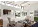 Bright open living room with clerestory windows, seamless flow to kitchen and large slider to patio at 5960 E Orange Blossom Ln, Phoenix, AZ 85018