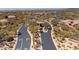 An aerial view of the neighborhood entrance featuring winding roads and desert landscaping, creating an inviting sense of arrival at 6522 E Night Glow Cir, Scottsdale, AZ 85266