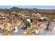 An aerial view showcasing desert landscaping and golf course views at 6522 E Night Glow Cir, Scottsdale, AZ 85266