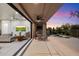 Indoor and outdoor living blend seamlessly with this back patio and living room beyond the large glass door at 6522 E Night Glow Cir, Scottsdale, AZ 85266