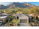 Charming single-story home with desert landscaping and a mountain view, nestled in a serene neighborhood setting at 6522 E Night Glow Cir, Scottsdale, AZ 85266