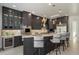 Spacious kitchen featuring bar stool seating, granite countertops, and stainless steel appliances at 6522 E Night Glow Cir, Scottsdale, AZ 85266