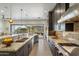 Open kitchen featuring granite counters, stainless appliances, gray cabinetry, and sliding glass doors at 6522 E Night Glow Cir, Scottsdale, AZ 85266