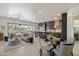 Open-concept living room and kitchen with modern furnishings and a view of the outdoors at 6522 E Night Glow Cir, Scottsdale, AZ 85266