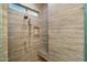 This bathroom has a walk-in shower with stone-look tile and a built-in shelf at 6522 E Night Glow Cir, Scottsdale, AZ 85266