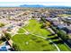 Aerial view of a community featuring a park with walking paths, playground, and mountain views in the distance at 690 W Mangrove Rd, Queen Creek, AZ 85140