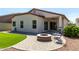 Large backyard with a fire pit, synthetic grass, and well-maintained landscaping at 690 W Mangrove Rd, Queen Creek, AZ 85140