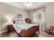 Cozy bedroom featuring hardwood floors and ample natural light at 690 W Mangrove Rd, Queen Creek, AZ 85140