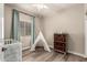 Charming bedroom with hardwood floors, a teepee and dresser at 690 W Mangrove Rd, Queen Creek, AZ 85140