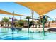 Enjoy the sunshine at this community pool with a water feature and covered lounge area at 690 W Mangrove Rd, Queen Creek, AZ 85140