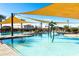 Relax and unwind at the community pool, featuring a shallow end and shade covers at 690 W Mangrove Rd, Queen Creek, AZ 85140