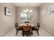 Cozy dining area featuring a round table, modern chandelier, and neutral decor at 690 W Mangrove Rd, Queen Creek, AZ 85140