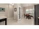 Bright dining area with a modern chandelier and views of the backyard at 690 W Mangrove Rd, Queen Creek, AZ 85140