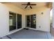 A covered patio with sliding glass doors leading to the backyard, perfect for relaxing at 690 W Mangrove Rd, Queen Creek, AZ 85140