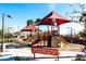 Community playground with slides, climbing structures, shade canopies, benches, and landscaping at 690 W Mangrove Rd, Queen Creek, AZ 85140