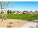 Well-maintained community soccer field with lush green grass, soccer nets, and a walking path in a Gathering-friendly neighborhood at 690 W Mangrove Rd, Queen Creek, AZ 85140