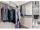 Organized walk-in closet with shelving and hanging rods at 690 W Mangrove Rd, Queen Creek, AZ 85140