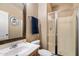 Bathroom featuring a shower with glass doors, a towel rack, and a sink with a wood cabinet at 7238 W El Cortez Pl, Peoria, AZ 85383