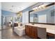 Stylish bathroom features a soaking tub, double vanity with ample counter space, and great lighting at 7238 W El Cortez Pl, Peoria, AZ 85383
