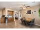 Casual dining area with a table and chairs, adjacent to a kitchen with ample natural light at 7238 W El Cortez Pl, Peoria, AZ 85383