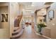 Inviting home entryway featuring neutral paint, tile flooring, staircase and an open floor plan at 7238 W El Cortez Pl, Peoria, AZ 85383
