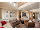 Cozy living room featuring plush seating, decor, and an inviting atmosphere for gatherings at 7238 W El Cortez Pl, Peoria, AZ 85383