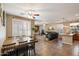 Open living space with a seamless flow between the dining area, living room and kitchen at 7238 W El Cortez Pl, Peoria, AZ 85383