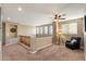Upstairs loft features neutral paint, carpet, a ceiling fan, and ample natural light at 7238 W El Cortez Pl, Peoria, AZ 85383