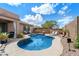 Sparkling pool surrounded by a well-maintained backyard with lounge chairs and mature landscaping at 7554 E Globemallow Ln, Gold Canyon, AZ 85118