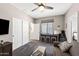 Bedroom with carpeted floors, a ceiling fan, and a workstation with three stools providing ample space at 7554 E Globemallow Ln, Gold Canyon, AZ 85118