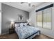 Well-lit bedroom featuring a bed, bedside tables, and a window with blinds providing ample natural light at 7554 E Globemallow Ln, Gold Canyon, AZ 85118