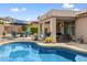 Private pool area featuring a covered patio, fire pit, and lounge chairs at 7554 E Globemallow Ln, Gold Canyon, AZ 85118