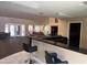 A community bar with granite counters, bar stool seating, and an attached rec room at 8260 E Arabian Trl # 275, Scottsdale, AZ 85258